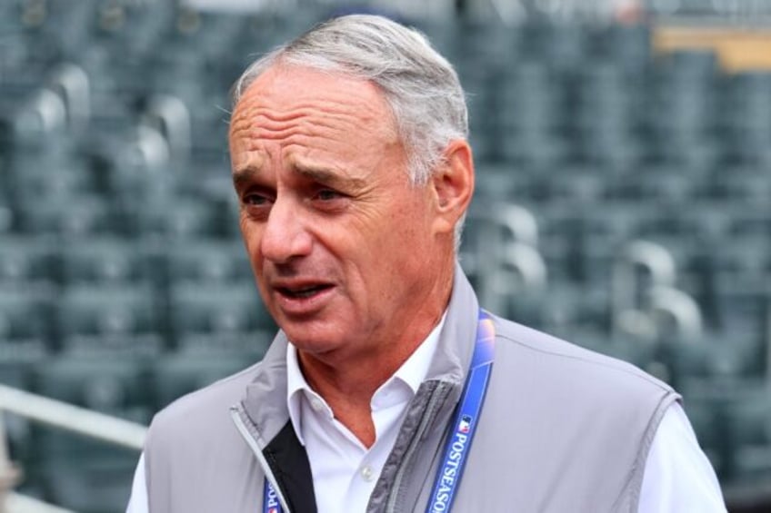 Major League Baseball commissioner Rob Manfred says he plans to step down after completing