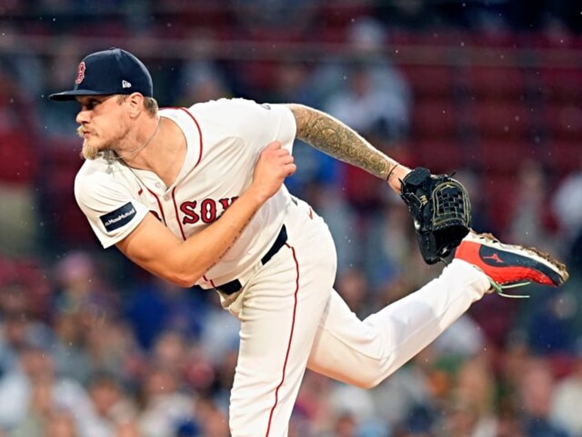 Boston Red Sox starting pitcher Tanner Houck throws during the first inning of a baseball