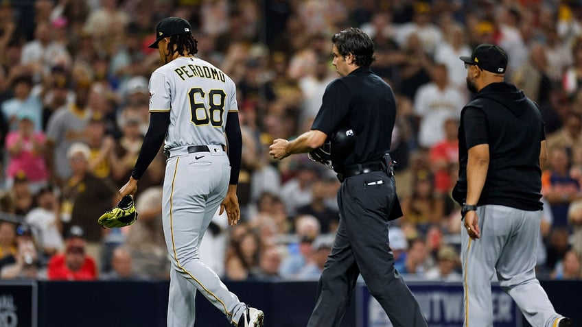 mlb suspends pirates pitcher angel perdomo for intentionally throwing at padres star manny machado