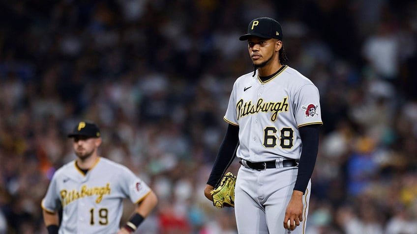 mlb suspends pirates pitcher angel perdomo for intentionally throwing at padres star manny machado