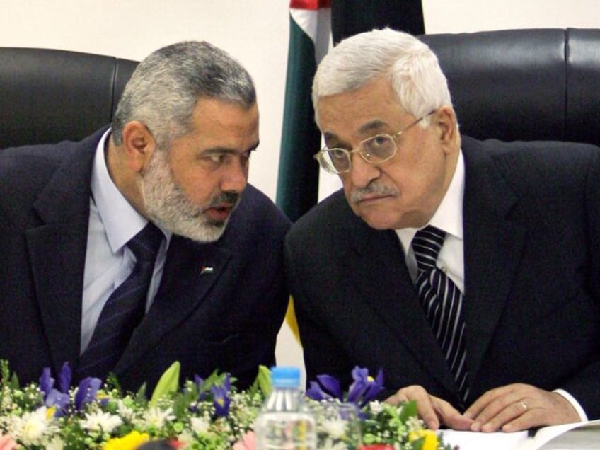 FILE- In this March 18, 2007 file photo, Palestinian Authority President Mahmoud Abbas, ri