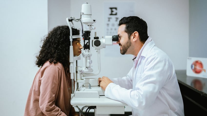 Young woman doing optical exam at medical clinic