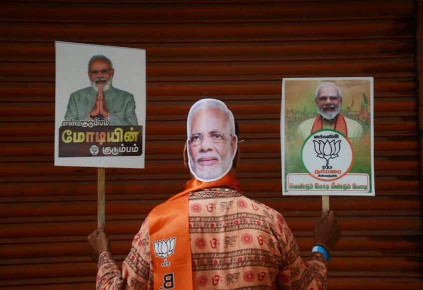 modi hangs on to power in india with smaller margin