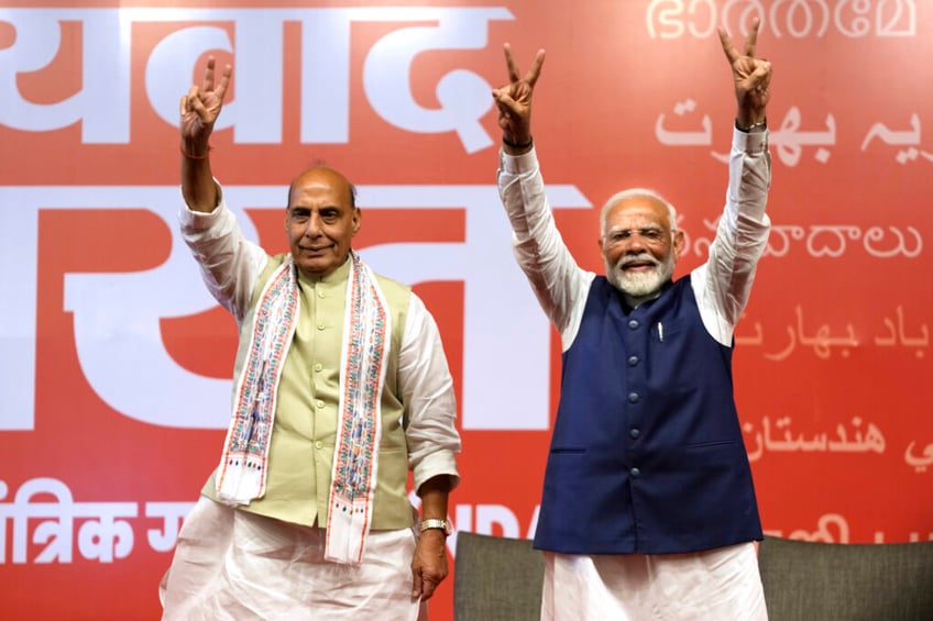 modi hangs on to power in india with smaller margin
