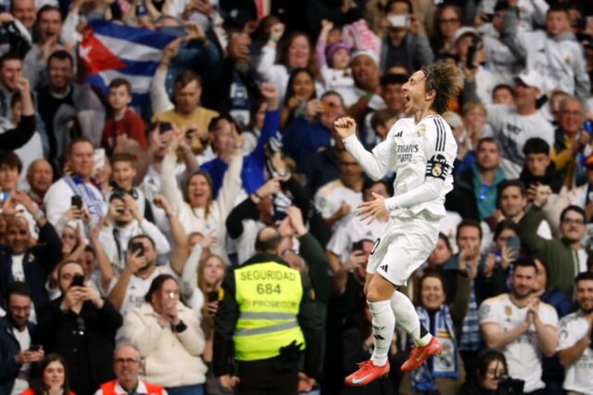 Real Madrid's Croatian midfielder Luka Modric celebrates scoring the opening goal against