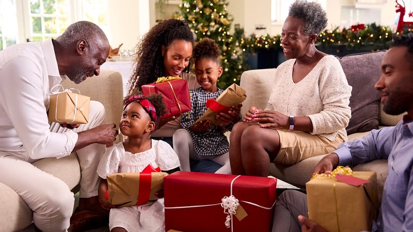 family opens presents on christmas