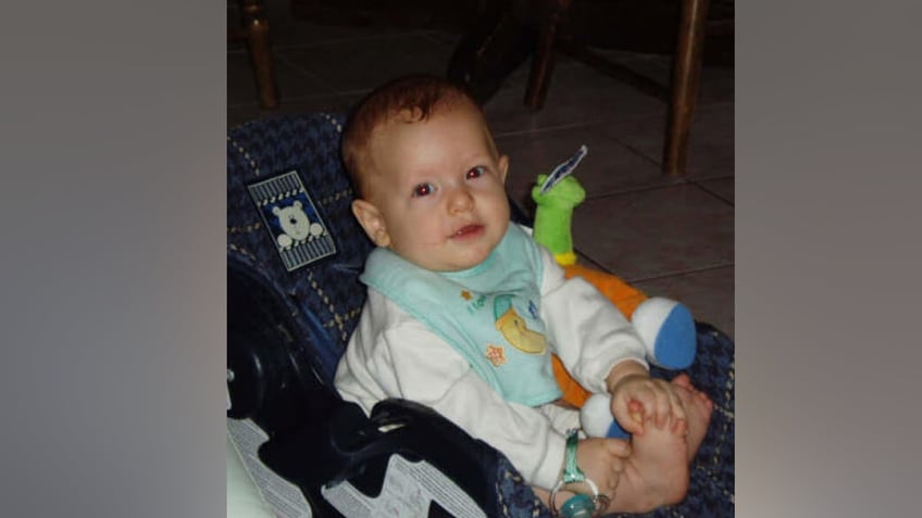 Bryce Balfour sitting in a carseat