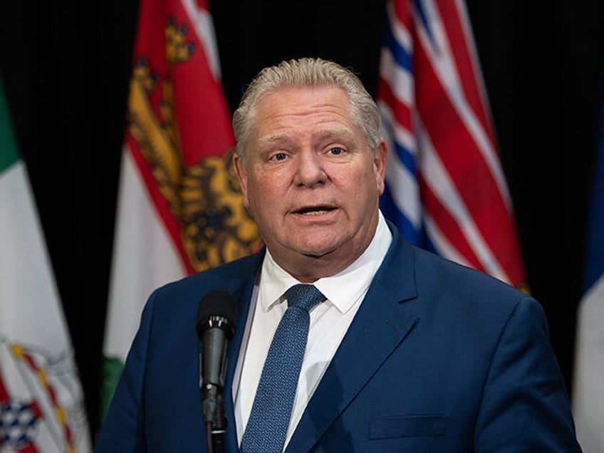 Doug Ford, Ontario's premier, speaks to members of the media as he arrives for a meeting i