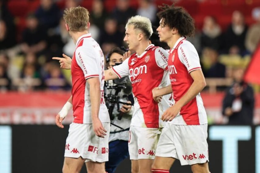 Aleksandr Golovin (C) celebrates after scoring Monaco's third goal in their win against Re