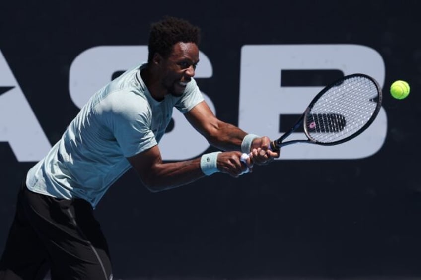 France's Gael Monfils hits a return to Belgium's Zizou Bergs during their men's singles fi