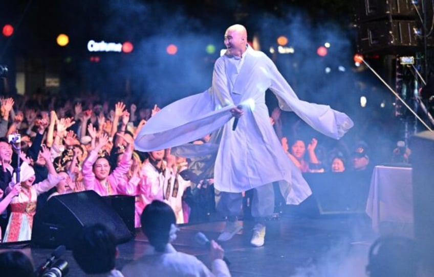 South Korean comedian Youn Sung-ho known as 'NewJeansNim' weas monk's robes while performi