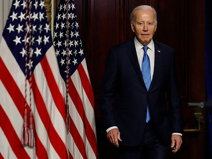 U.S. President Joe Biden arrives for a meeting of his National Infrastructure Advisory Council in the Indian Treaty Room of the Eisenhower Executive Office Building on December 13, 2023 in Washington, DC. Biden talked about his administration's success in passing the $1 trillion Bipartisan Infrastructure Law, legislation that is "not …