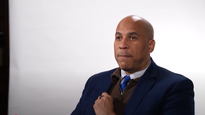 Cory booker sits for a video