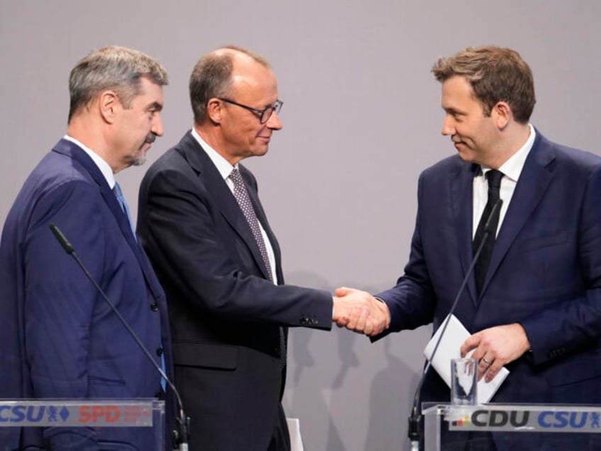 Friedrich Merz, Christian Democratic Union party chairman shakes hands with the Social Dem