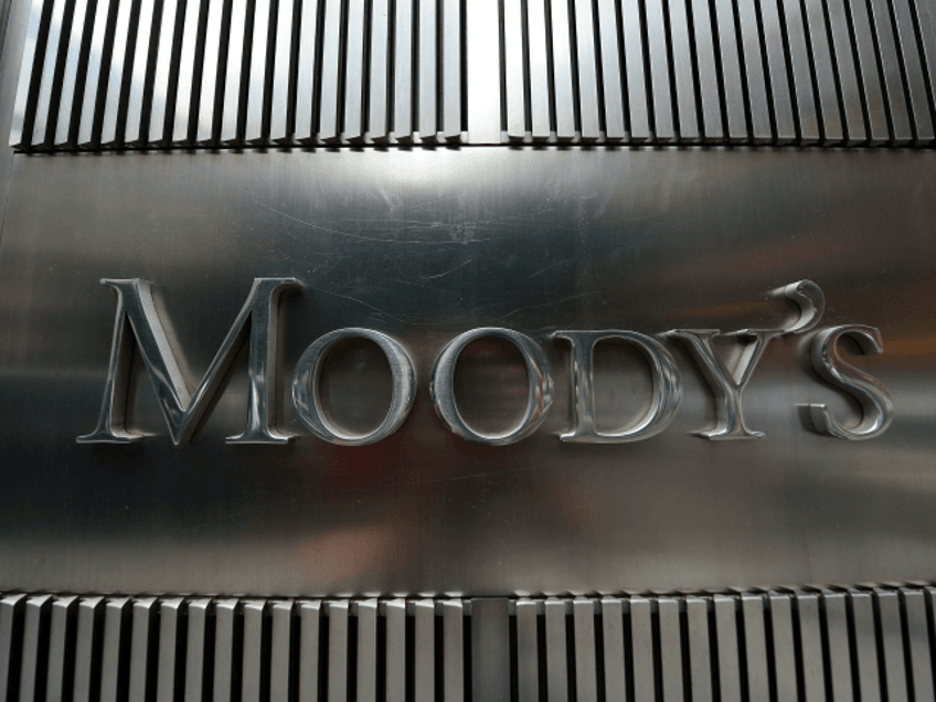 A sign for Moody's rating agency is displayed at the company headquarters in New York