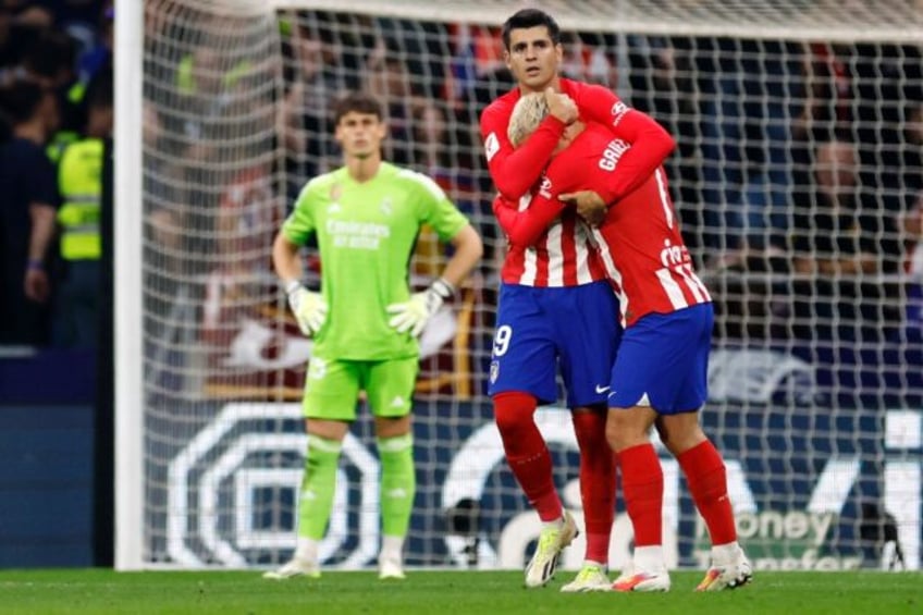 morata brace helps atletico end real madrid winning streak