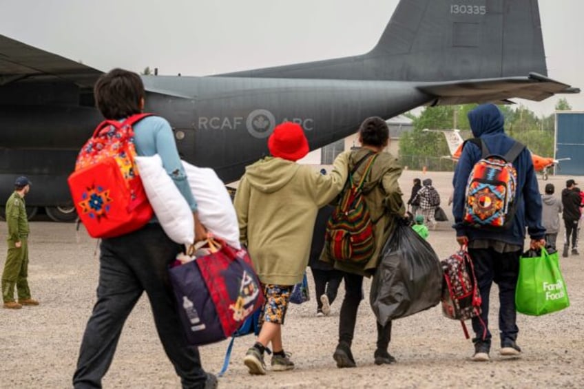Thousands of people, including those pictured here in Manitoba, have been evacuated