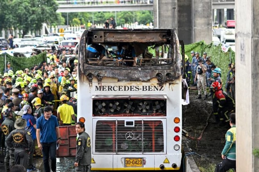 A devastating blaze tore through the coach on a highway in a northern Bangkok suburb as it