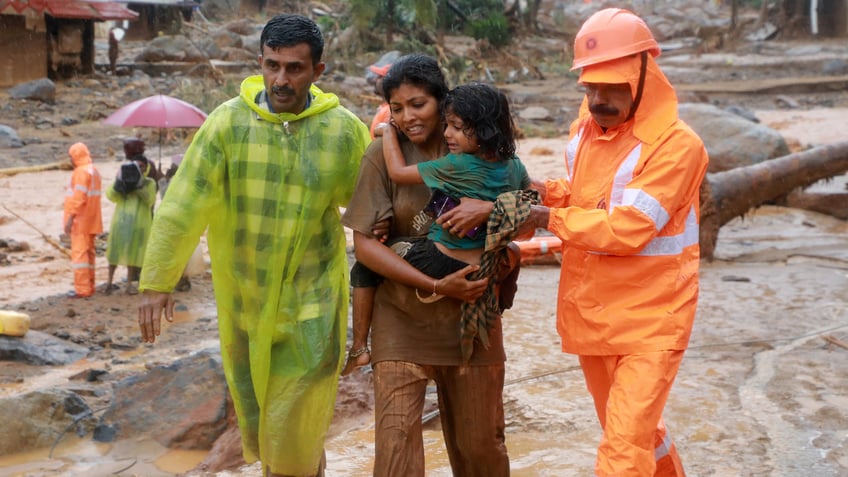 Rescuers help residents