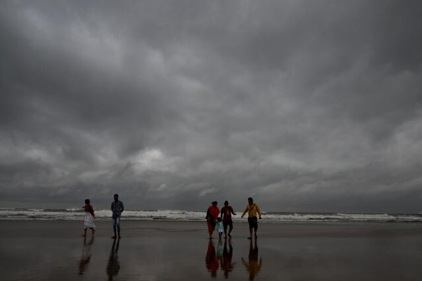 People on India's eastern coast are fleeing to storm shelters before Cyclone Dana makes la