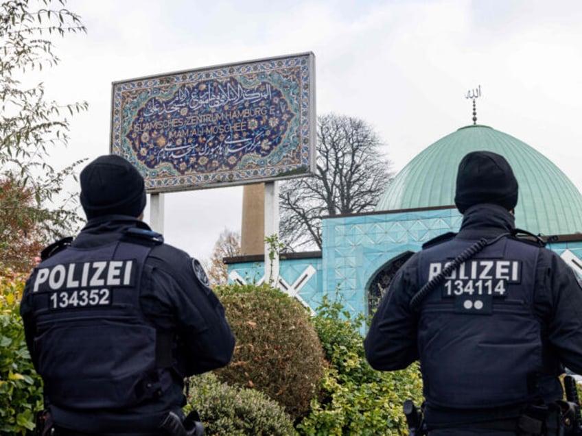 Police officers are pictured during the search of the "Blue Mosque", housing the Islamic C