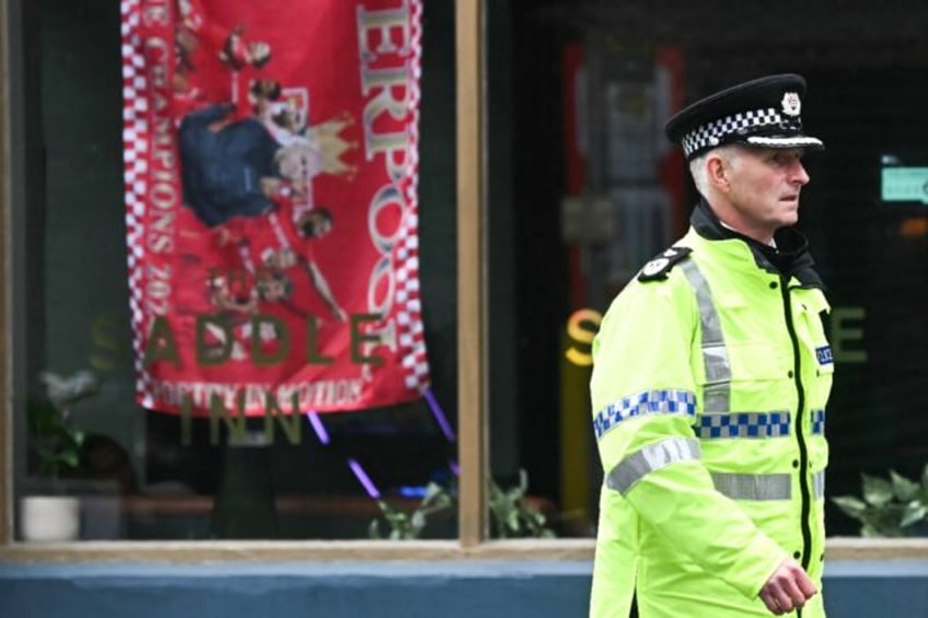 A parade marking Liverpool's Premier League win came was marred when a car ploughed into c