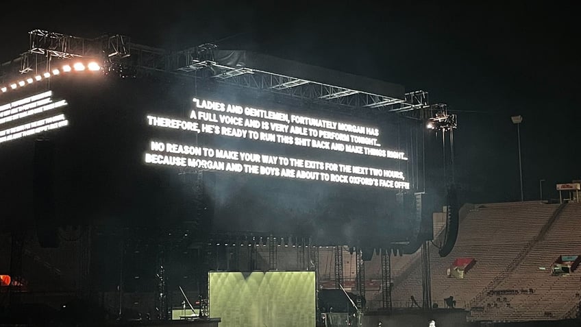 Picture of a message on the jumobtron at Morgan Wallen's concert poking fun at his concert cancellation last year
