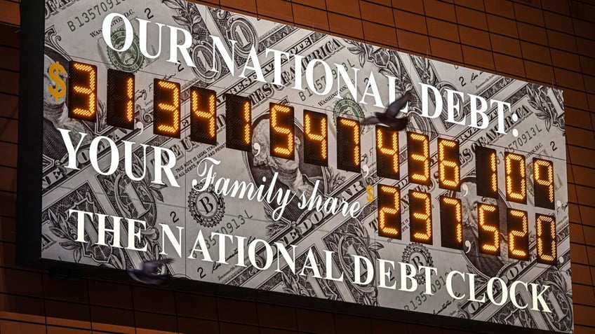 NEW YORK, UNITED STATES - JANUARY 19: A screen shows the national debt clock after the US hit its debt limit and the Treasury started using extraordinary measures to avoid default on January 19, 2023. (Photo by Fatih Aktas/Anadolu Agency via Getty Images)