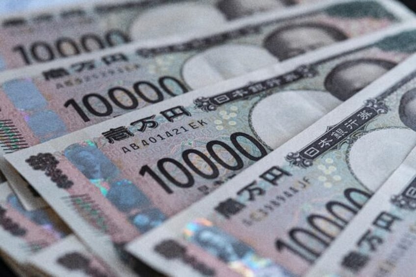 The yen was marginally stronger on Friday after data showed inflation in Tokyo rose for a