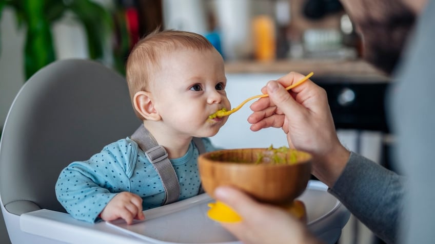 Parent feeding baby