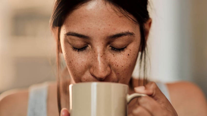 Woman sipping coffee