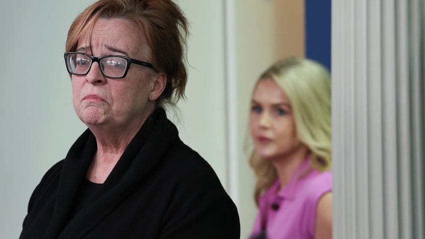 WASHINGTON, DC - APRIL 16: Patty Morin (L), mother of Rachel Morin, speaks as White House Press Secretary Karoline Leavitt looks on during a daily press briefing in the Brady Press Briefing Room at the White House on April 16, 2025 in Washington, DC. In 2023, Morin's daughter was murdered by Victor Martinez-Hernandez, an illegal immigrant from El Salvador who was convicted of first-degree murder and first-degree rape on Monday. During the briefing, Leavitt addressed the Trump administration's illegal deportation of Kilmar Armando Abrego Garcia, a Maryland man who has been held in prison in El Salvador since March 15. (Photo by Win McNamee/Getty Images)