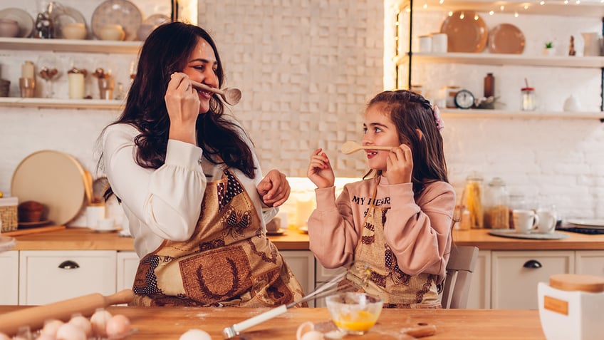 Mom and daughter cooking