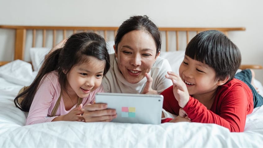 Mom and kids on tablet