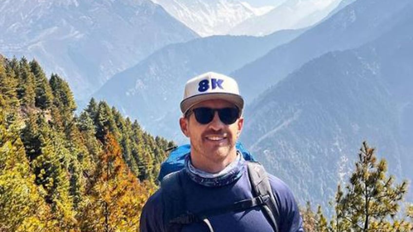 Dan Paterson smiling on a mountain