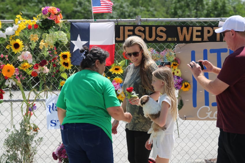 mourners gather at kerrville memorial display in aftermath of texas floods
