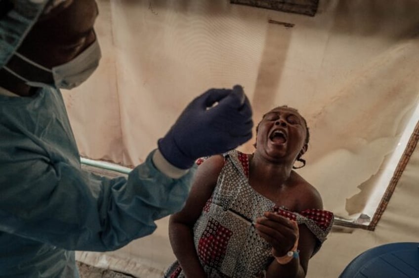 A patient is tested for mpox at a Democratic Republic of Congo hospital as the country rep