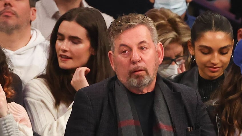 James Dolan looks on court