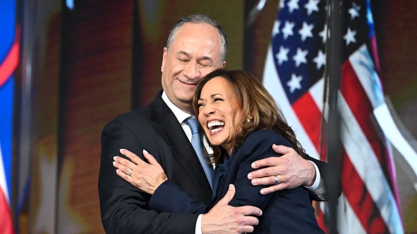 Photo of Doug Emhoff embracing Kamala Harris