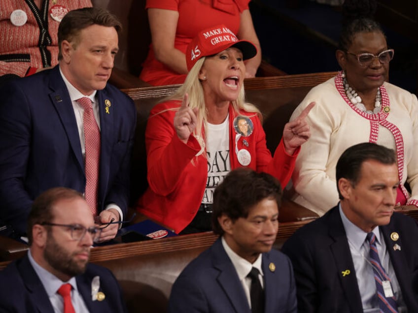 U.S. Rep. Marjorie Taylor Greene (R-GA) calls out as U.S. President Joe Biden delivers the