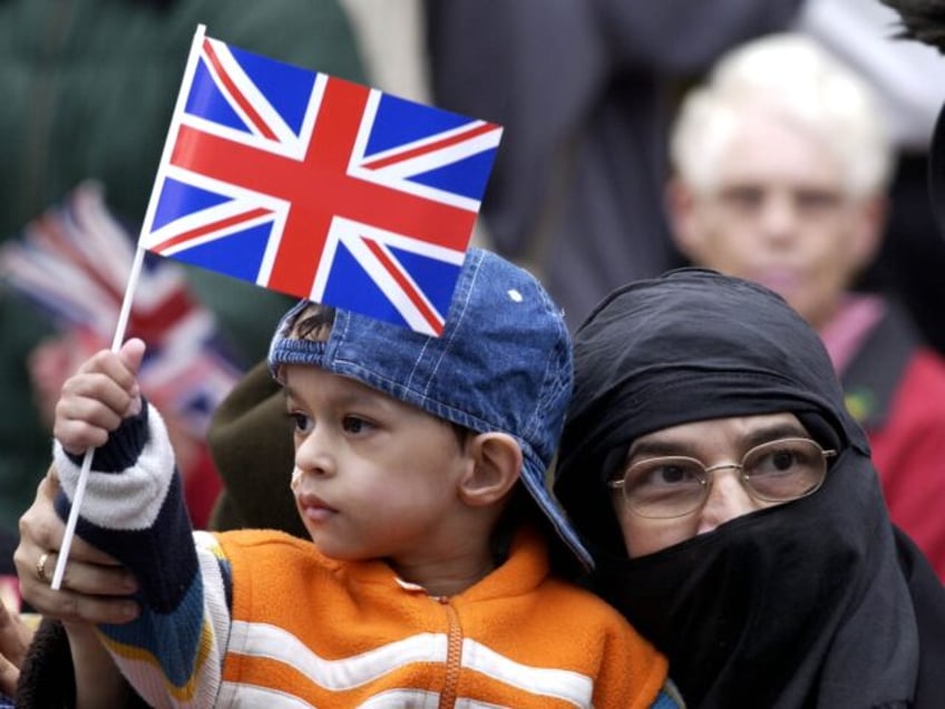 LONDON, UNITED KINGDOM - MAY 09: British Muslim mother and child in the East End of London