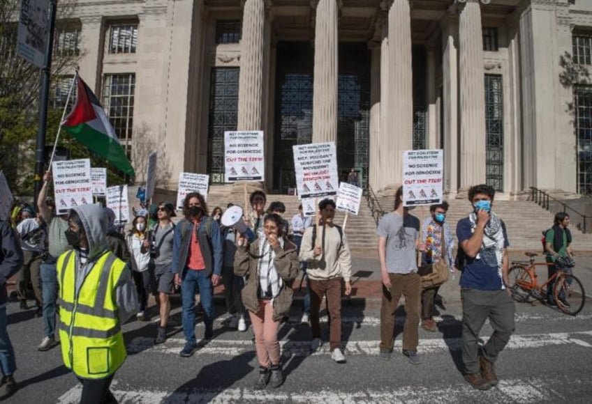 Pro-Palestinian protesters march across campus at the Massachusetts Institute of Technolog