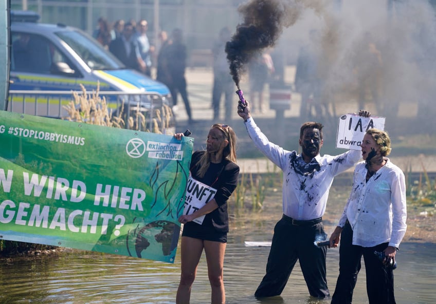 multiple climate protests upstage german chancellor crashing worlds largest motor industry fair