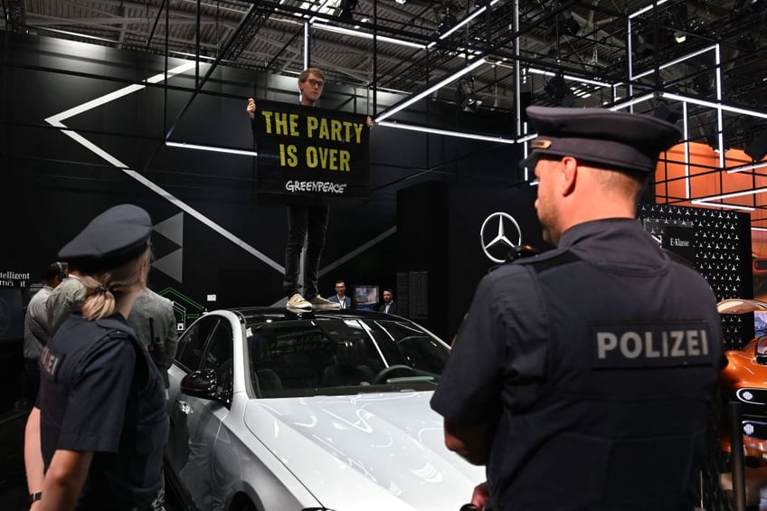 multiple climate protests upstage german chancellor crashing worlds largest motor industry fair