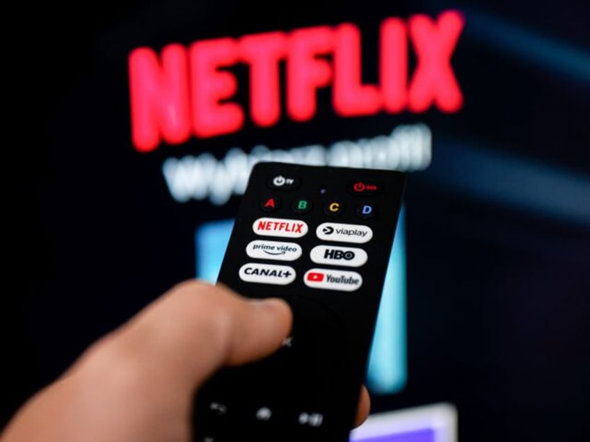 POLAND - 2024/09/20: In this photo illustration a Netflix logo seen on a TV remote in fron