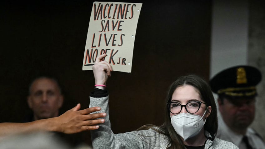 pro-vaccine demonstrator interrupting RFK Jr hearing