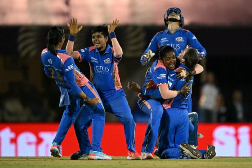 Mumbai players celebrate the dismissal of Delhi batter Jemimah Rodrigues