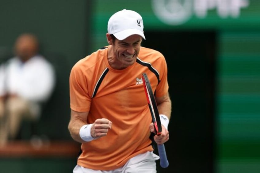 Britain's Andy Murray celebrates after defeating David Goffin of Belgium in the first roun