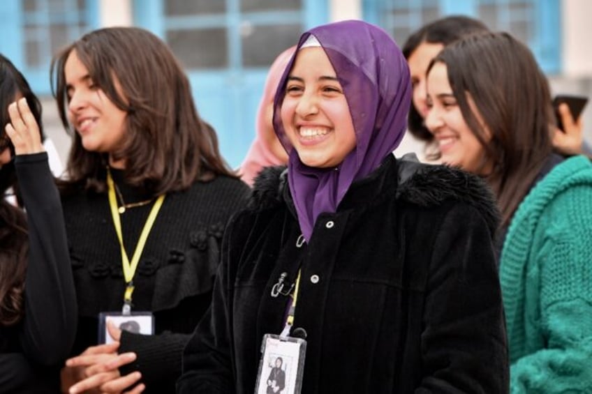 Sixteen-year-old Eya Makhloufi, in the centre, with music club members