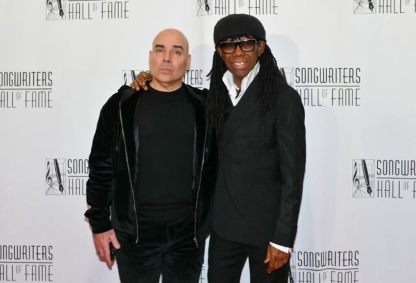 Hipgnosis executive Merck Mercuriadis (L) and co-founder Nile Rodgers attend the Songwrite